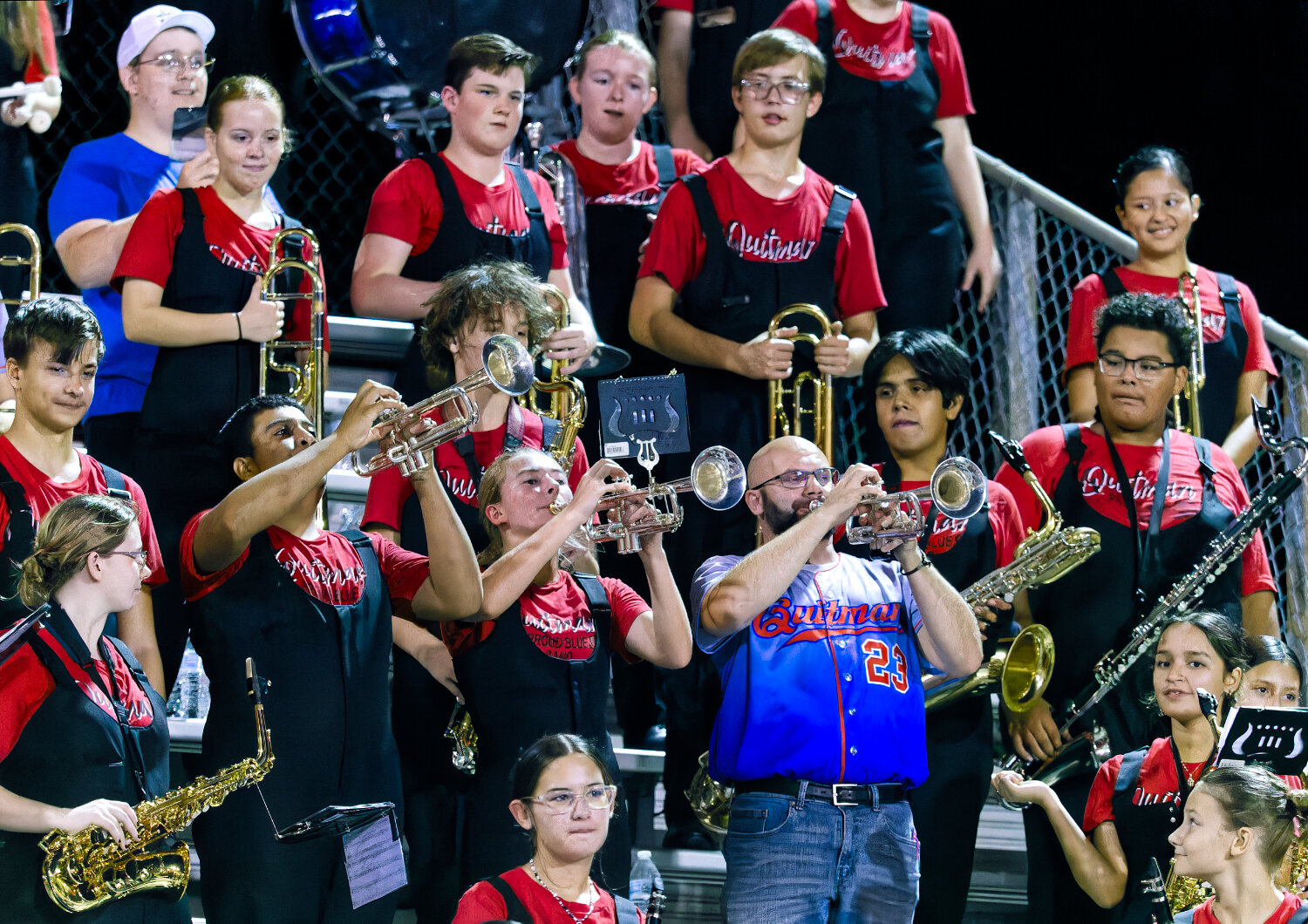 Quitman band director Michael Barron teaches the trumpet section about playing in the upper register as the other sections take notes. [few more photos here]